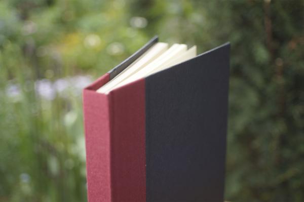 Classic black notebook with burgundy linen spine